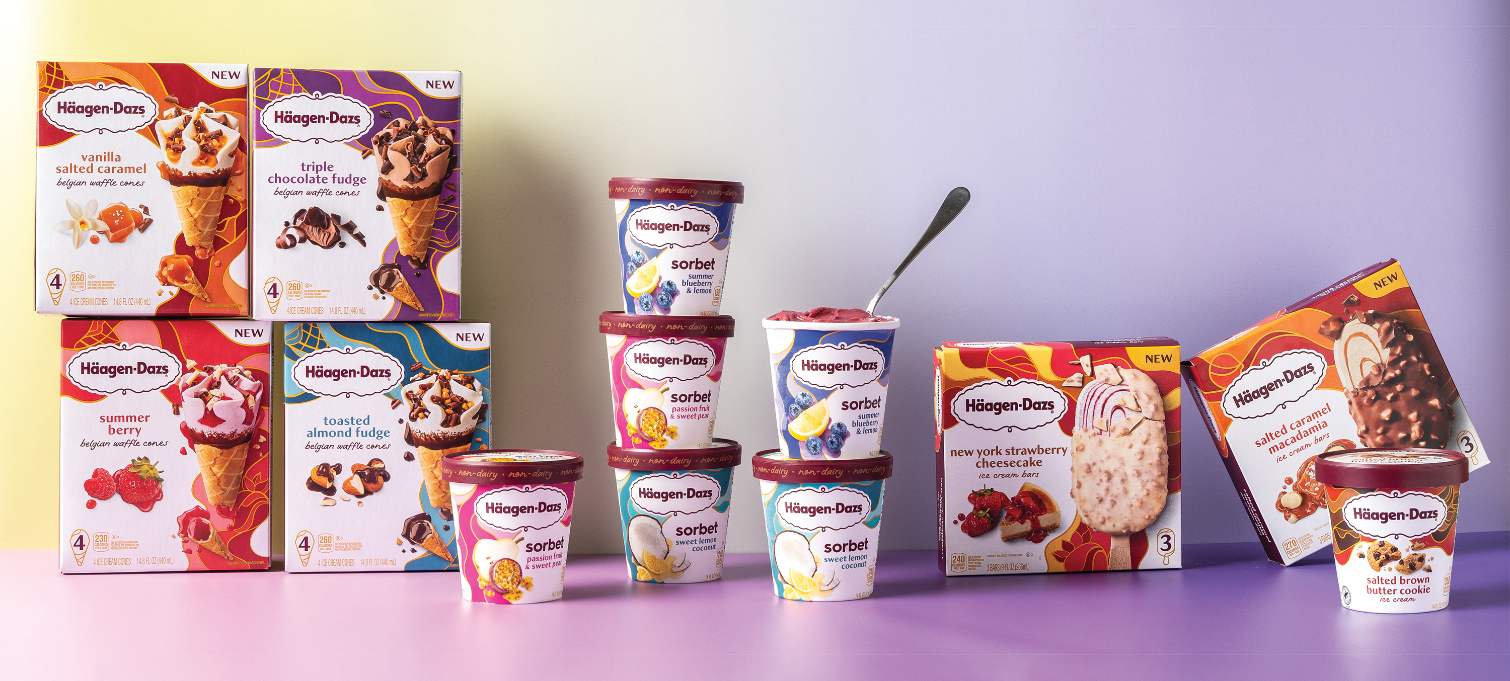 A variety of Haagen Dazs products arranged neatly on a table. 