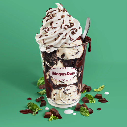 Mint Chip Dazzler Mint Chip Ice Cream layered with hot fudge and chocolate cookie pieces topped with whipped cream and chocolate sprinkles. Served with toppings.