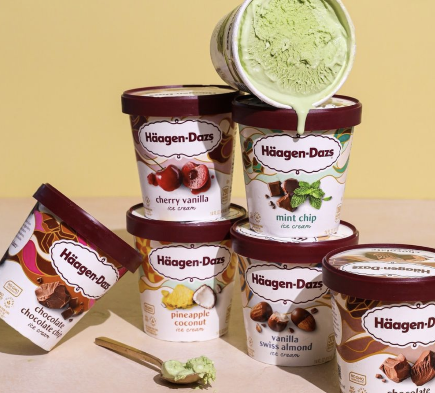 Various Haggen Dazs products stacked on a table. 