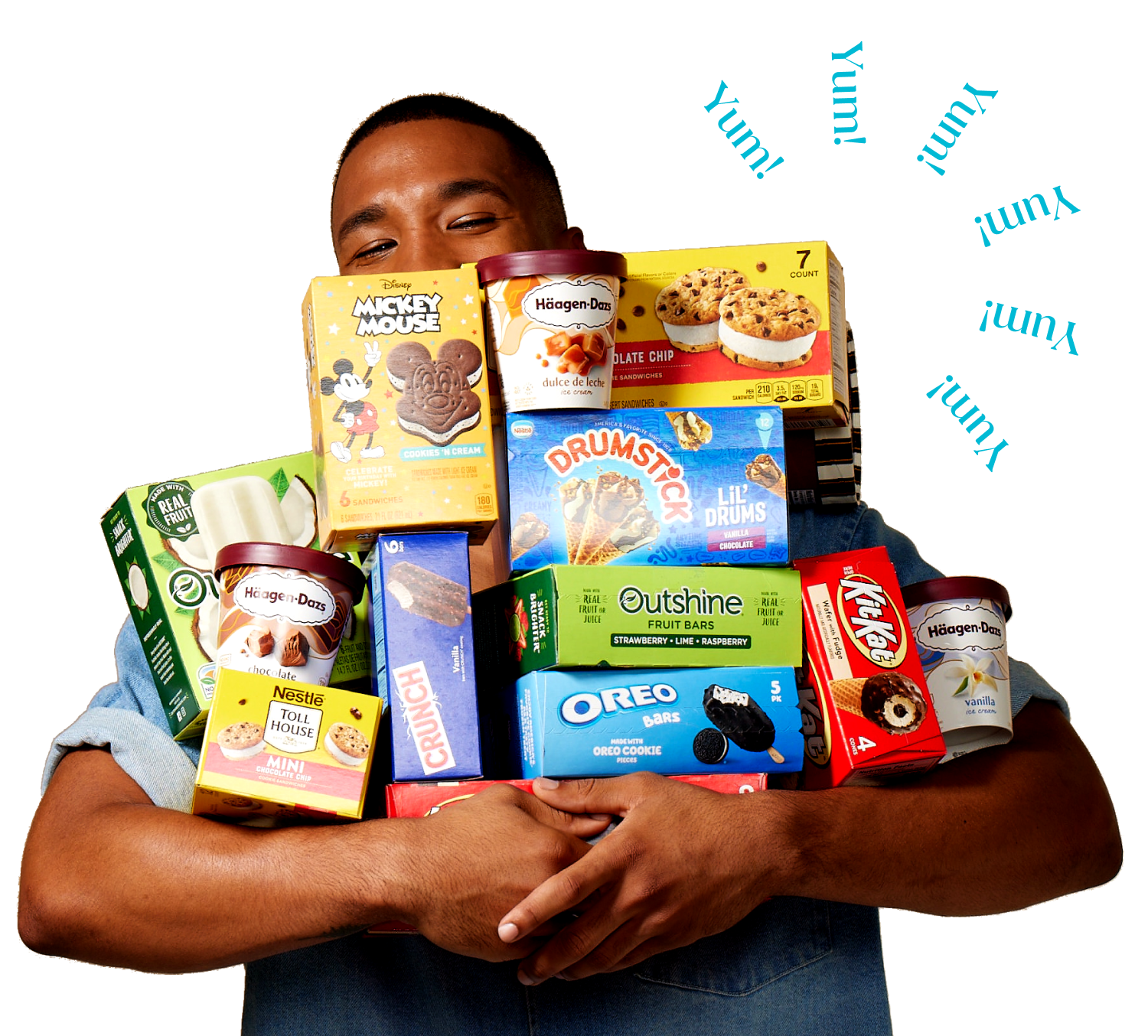 A man holding a large armful of various Dreyers products. 