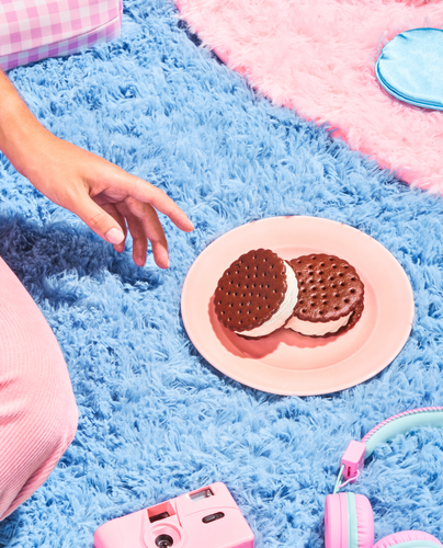 A plate with 2 Skinny Cow ice cream sandwiches.