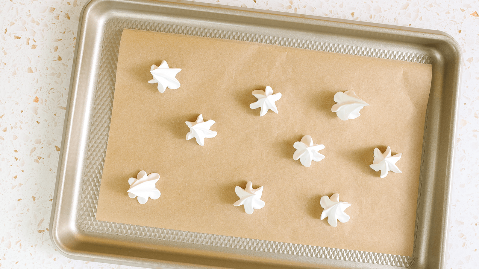 Haagen Dazs Pineapple Coconut Ice Cream Meringue Sandwiches on a tray.