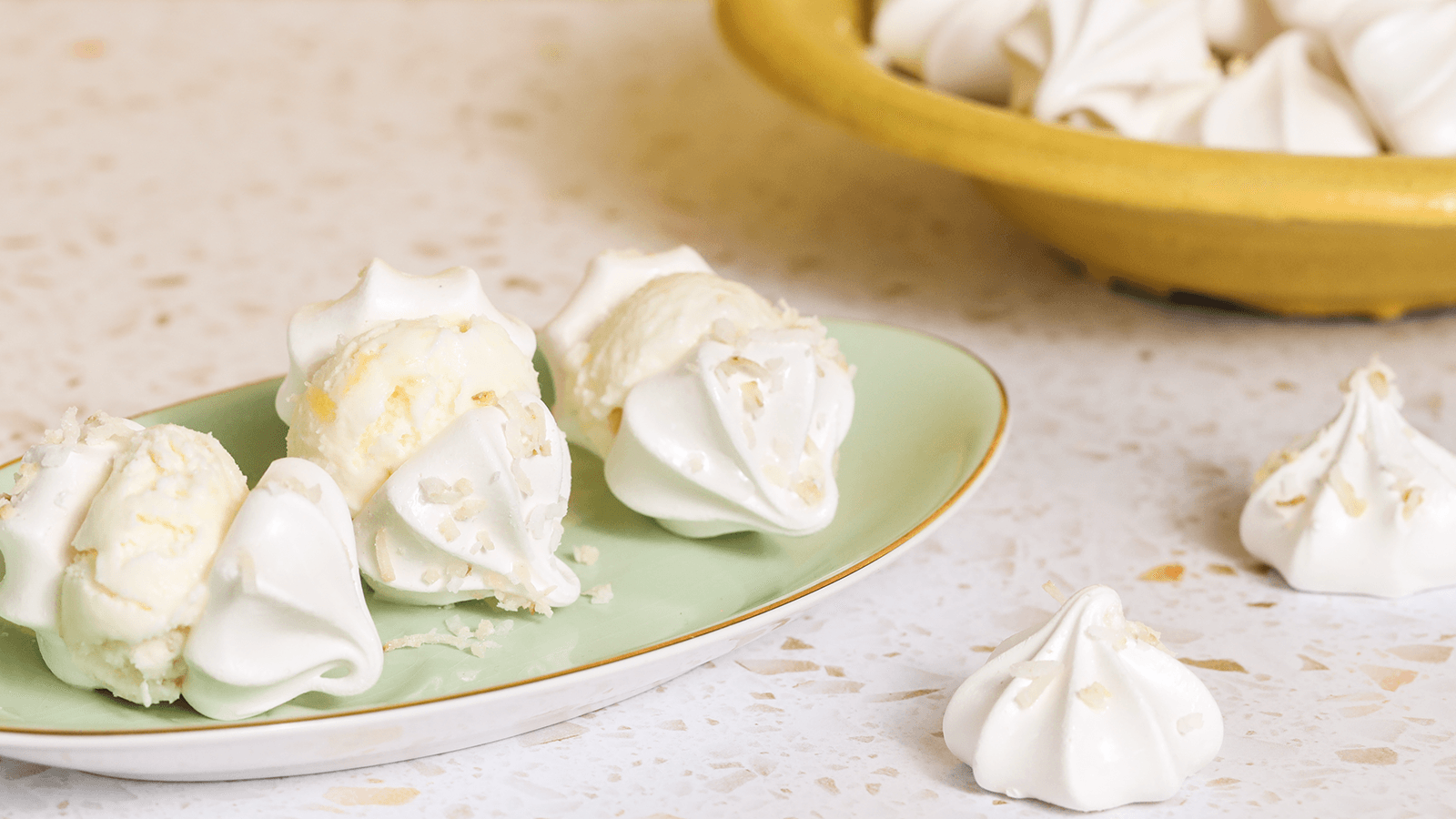 Haagen Dazs Pineapple Coconut Ice Cream Meringue Sandwiches on a plate.