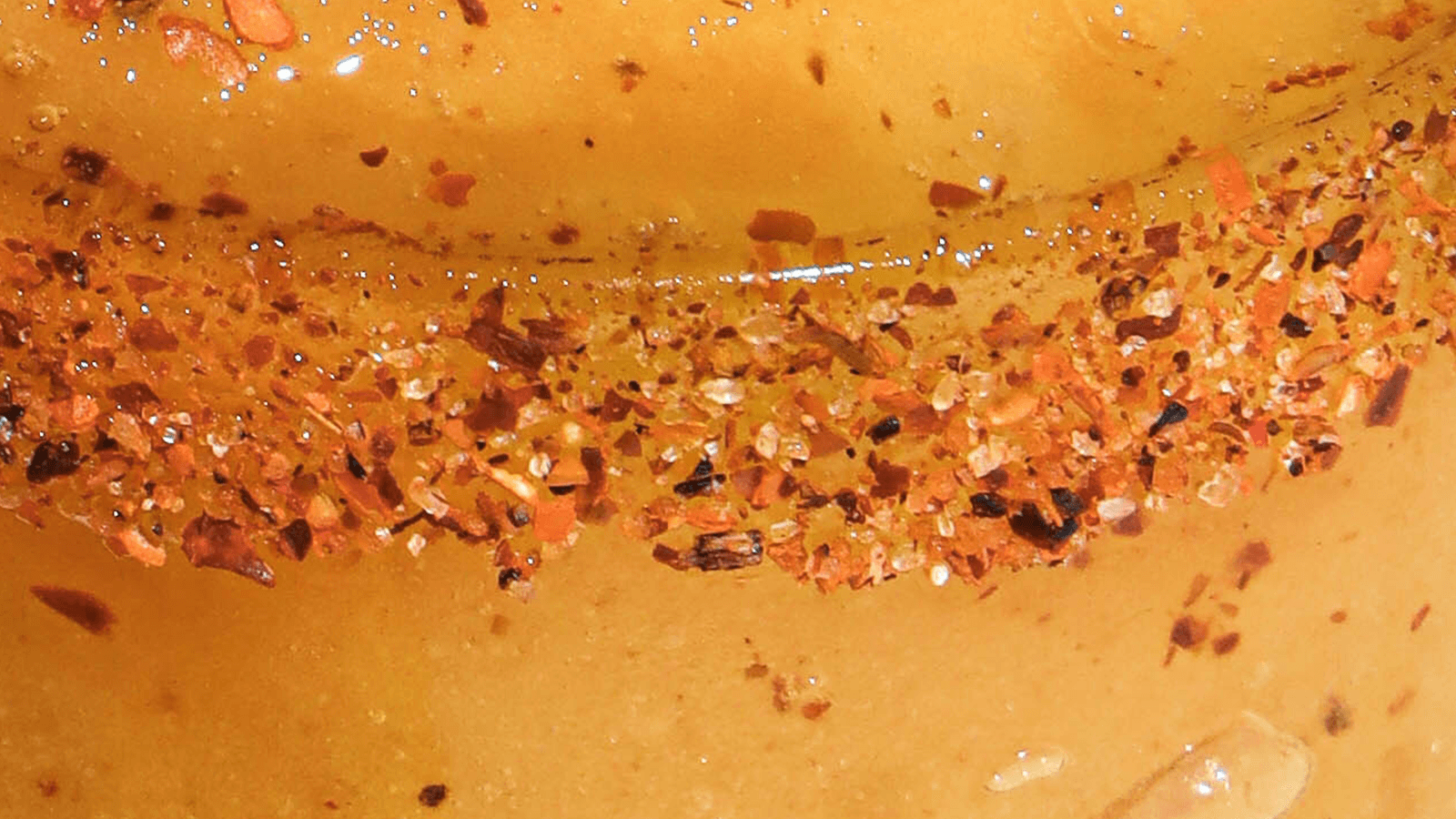Close up of a glass with tajin on the rim.