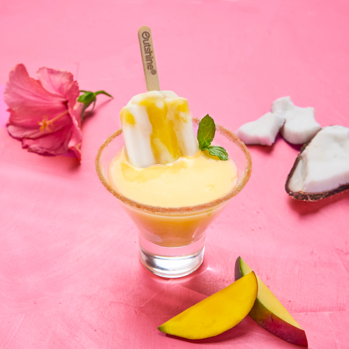 Sparkling Island cooler drink garnished with an Outshine frozen fruit bar. 