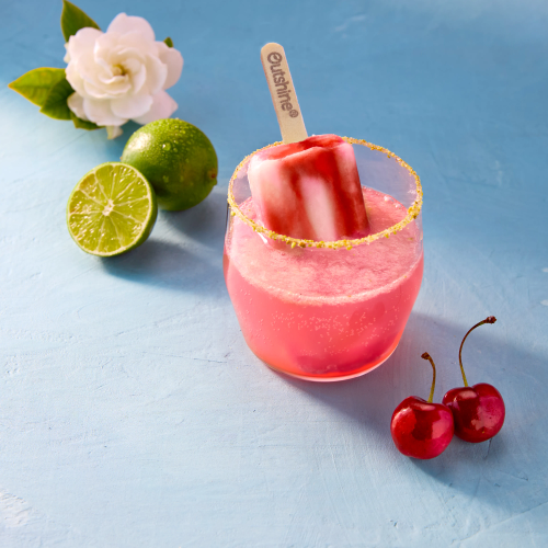 Tart Cherry Zest drink garnished with an Outshine frozen fruit bar. 